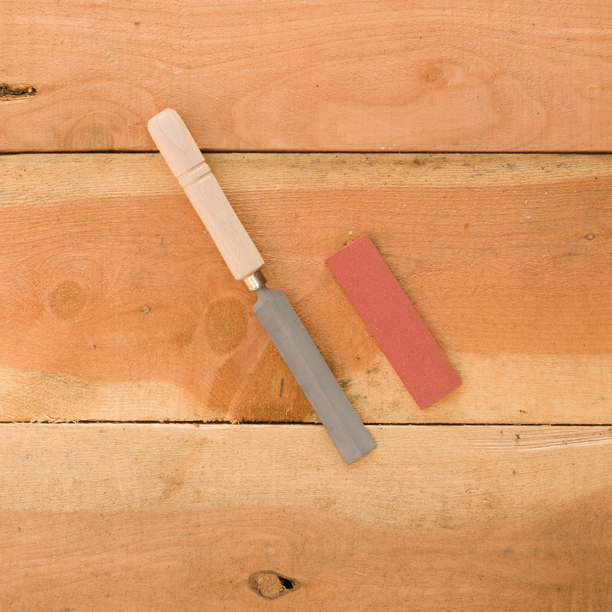 Comparison from left to right: saw sharpener (AC-9F10) and sharpening stone