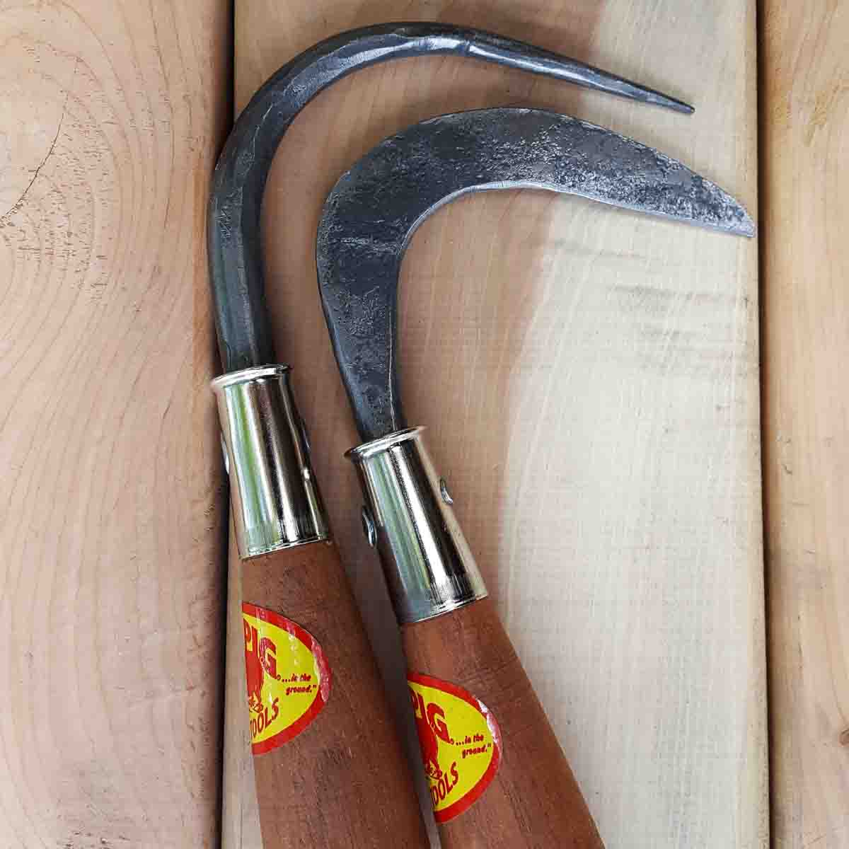 Crevice weeder next to a root hook, which is used for loosing bound up roots and pot bound plants prior to transplanting.
