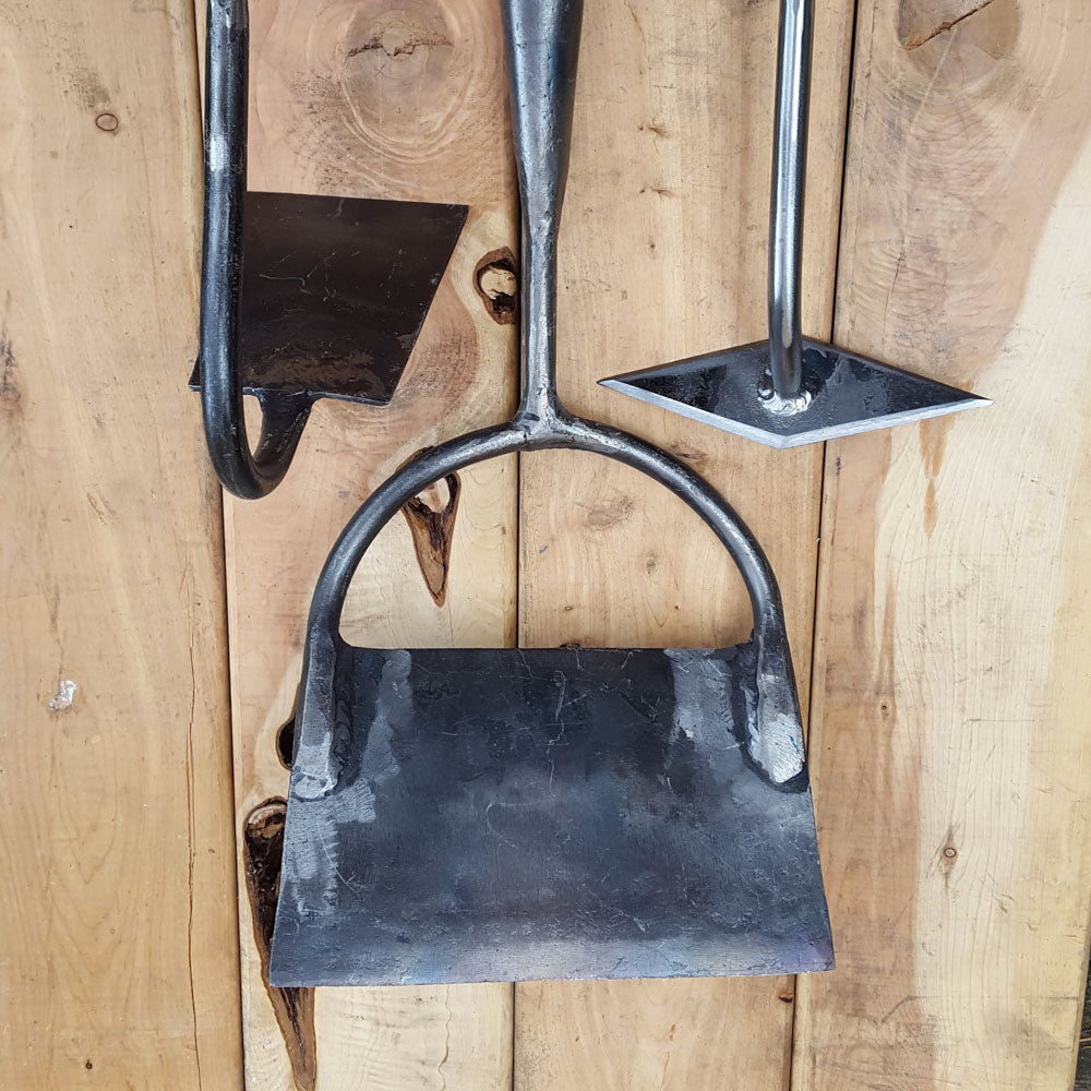 The diamond hoe is efficient for its size- seen here with a swan neck hoe and a Dutch push hoe.