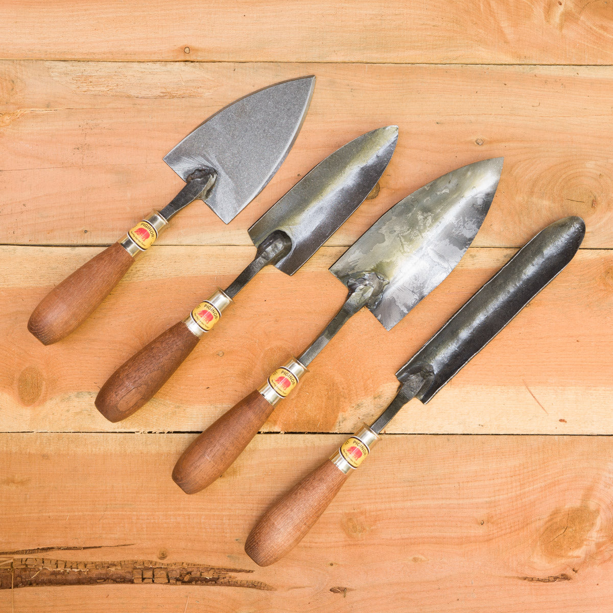 From left to right: Flat Trowel, Planter's Trowel, Trowel, Dandelion Trowel